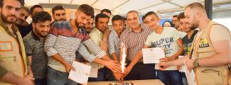A certificate distribution ceremony for beneficiaries of vocational training courses